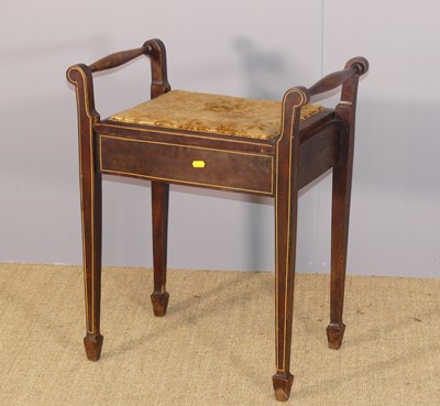Lot 630 - An Edwardian stained beech hinge-top music...