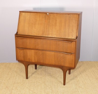 Lot 643 - A 1960s teak slope front student's bureau,...