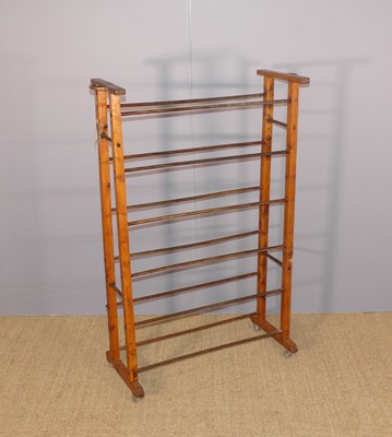 Lot 645 - A hat trolley, raised on wheeled castors, with...