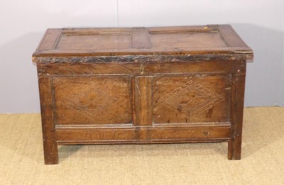 Lot 648 - An antique heavy joined oak two-panelled hinge-...
