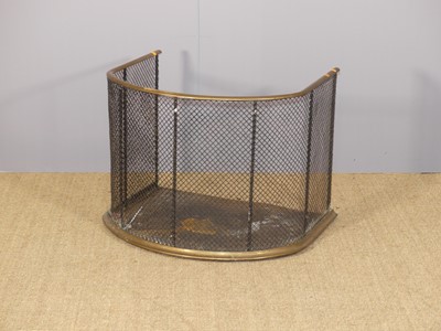 Lot 654 - A circa 1900 brass, iron and wired mesh inset...
