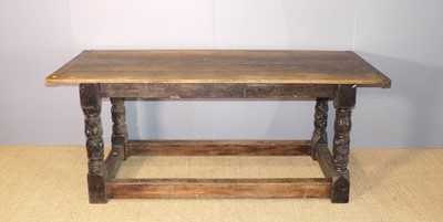 Lot 659 - A joined oak plank top refectory dining table,...