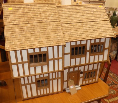 Lot 666 - Two doll houses in the Tudor taste, the first...