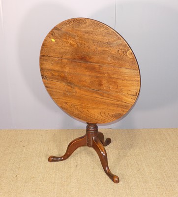Lot 668 - A George III provincial elm and oak circular...