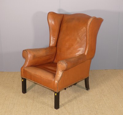 Lot 672 - A mahogany-framed tan leather-upholstered and...