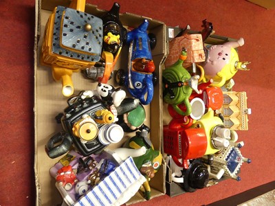 Lot 169 - A collection of novelty teapots, to include an...