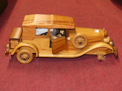 Lot 179 - A contemporary wooden model of a vintage car,...