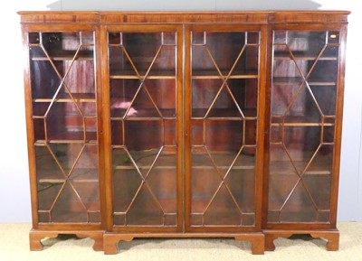 Lot 737 - A mahogany breakfront four door bookcase, the...