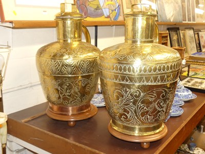Lot 191 - A pair of repoussé-decorated brass canisters,...