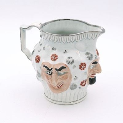 Lot 26 - A 19th century Staffordshire jug, decorated...