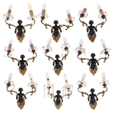 Lot 137 - A set of nine Rococo Revival gilt and black...