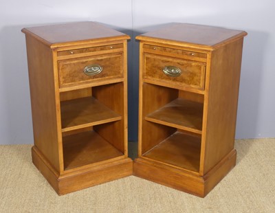 Lot 219 - A pair of walnut and burr walnut open bedside...