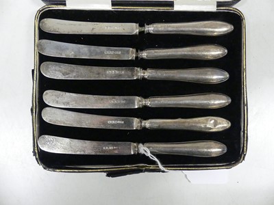 Lot 295 - A cased set of six George V silver cake knives,...