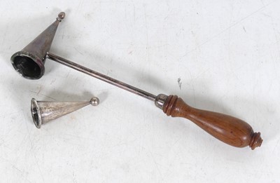 Lot 284 - A silver candle-snuffer with turned wooden...
