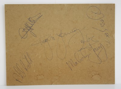 Lot AC/DC, a 15 x 20cm piece of card, signed in...