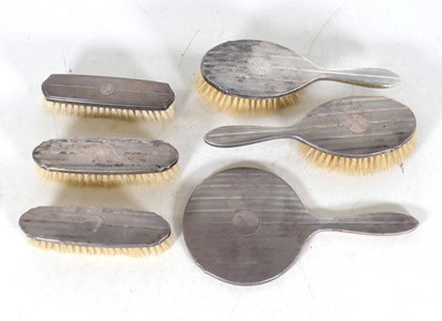 Lot 263 - A George V silver-backed dressing table set,...