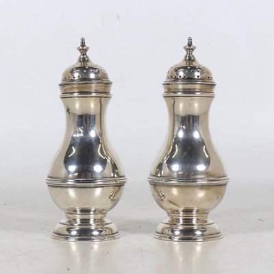Lot 267 - A pair of Edwardian silver pepperettes, each...