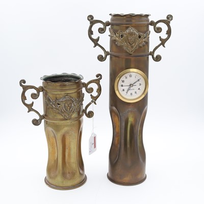 Lot 5 - A trench art shell case vase, with inset clock,...