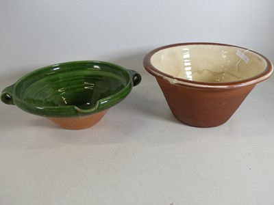 Lot 40 - A Victorian slip-glazed terracotta dairy bowl,...