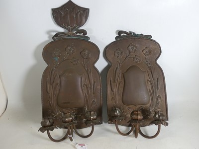Lot 44 - A pair of Arts & Crafts hammer-beaten and...