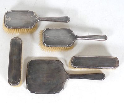Lot 298 - An Art Deco silver-backed five-piece dressing...