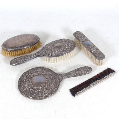 Lot 297 - An early 20th century four-piece silver-backed...