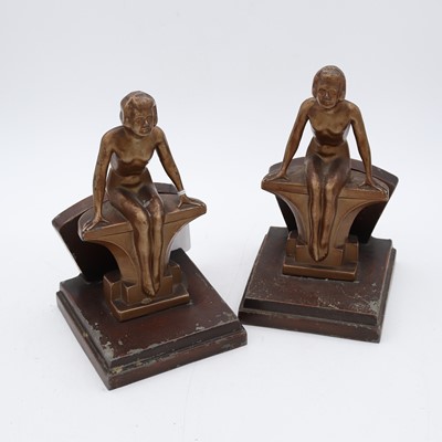 Lot 128 - A pair of Art Deco style painted spelter...