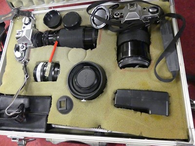 Lot 80 - A Canon AE-1 camera body, together with...