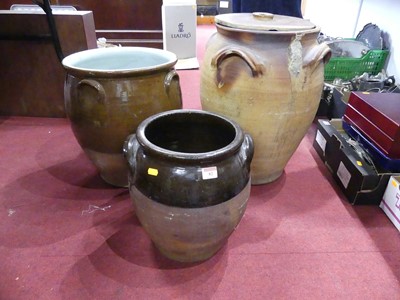 Lot 82 - A terracotta four-handled olive jar, with...