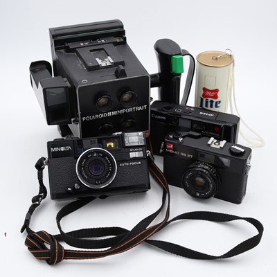 Lot 130 - A Polaroid Mini Portrait Instant camera, with...