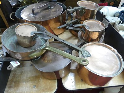 Lot 149 - A collection of copper saucepans, to include a...