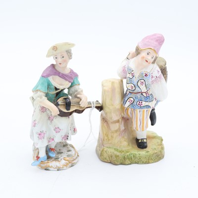Lot 95 - A Meissen porcelain figure of a lady playing a...