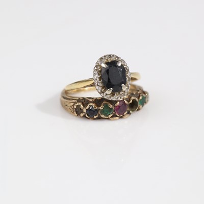 Lot 323 - A yellow metal, sapphire and diamond point-set...