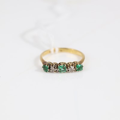 Lot 332 - An 18ct gold emerald and diamond five-stone...