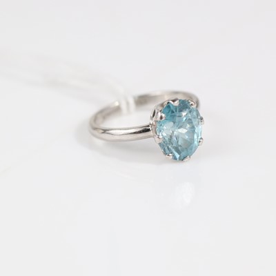 Lot 335 - A modern platinum and blue topaz set dress...