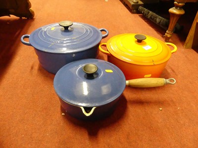 Lot 210 - A Le Creuset orange enamelled cast iron...