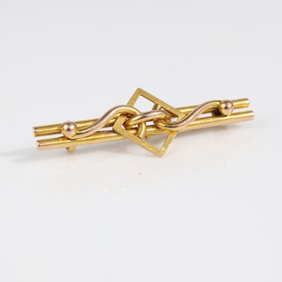 Lot 340 - An Art Deco yellow metal bar brooch, unmarked...