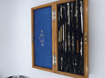 Lot 236 - An early 20th century oak cased set of drawing...