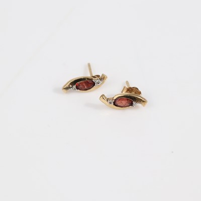 Lot 389 - A pair of 9ct gold garnet set ear studs, on...