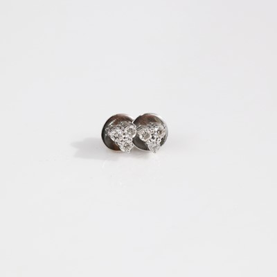 Lot 366 - A pair of white metal diamond ear studs, each...