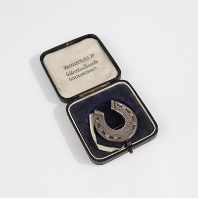 Lot 369 - A circa 1900 sterling silver horseshoe brooch,...