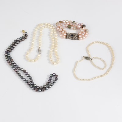 Lot 370 - A faux pearl triple-string bracelet with paste...