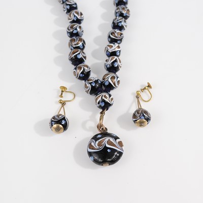 Lot 373 - A beaded knotted Venetian glass necklace with...